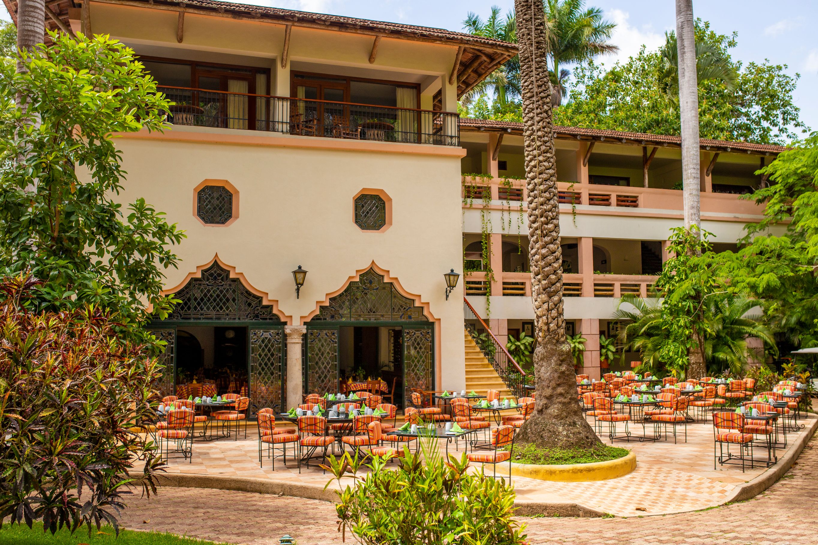 a building with tables and chairs outside