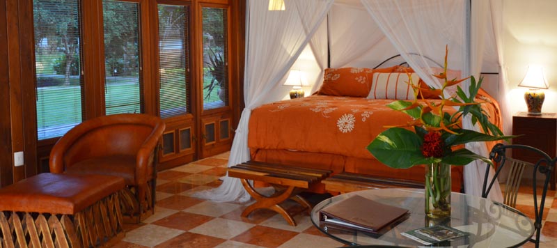 a bedroom with a four poster bed