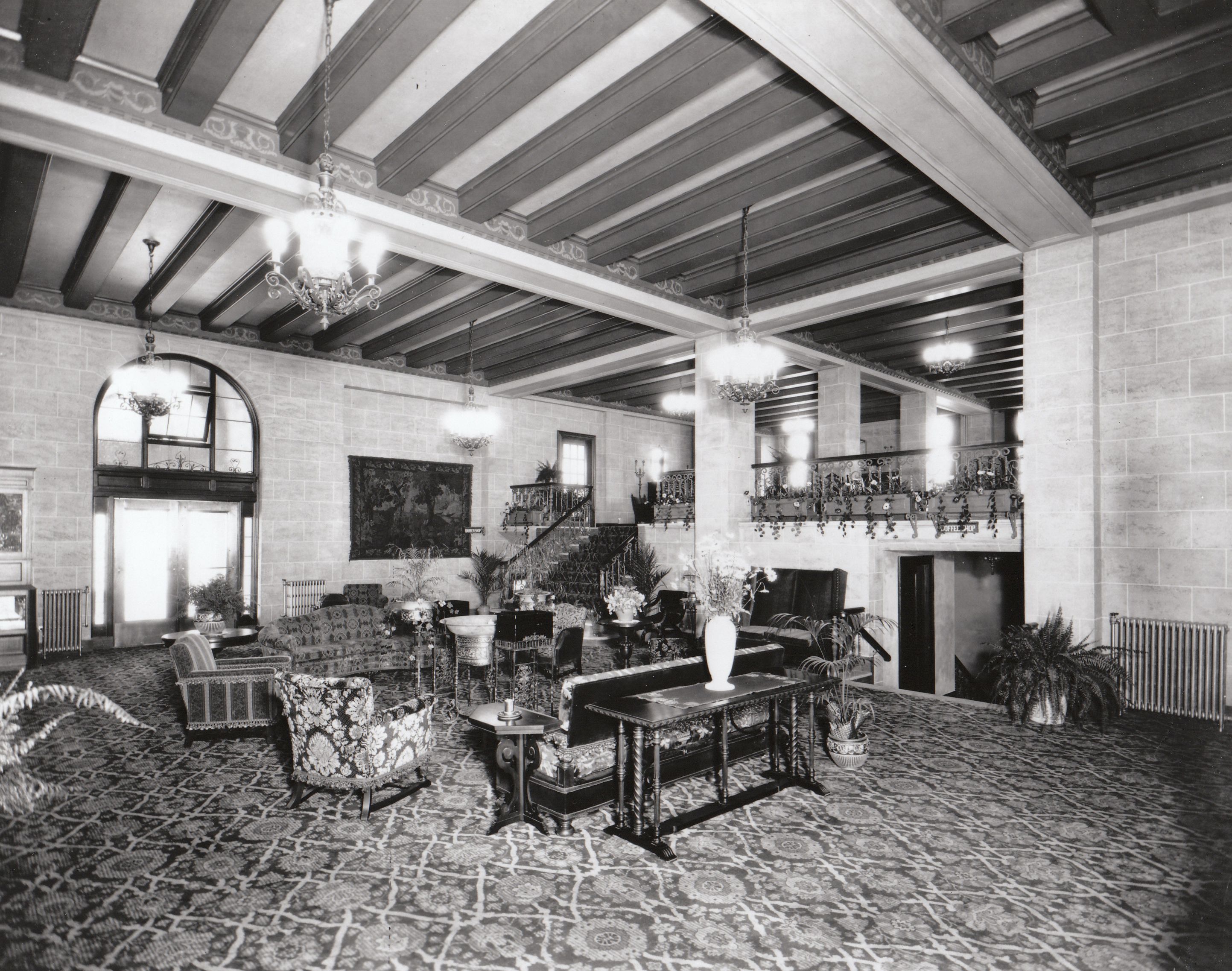 a room with a large ceiling and a staircase