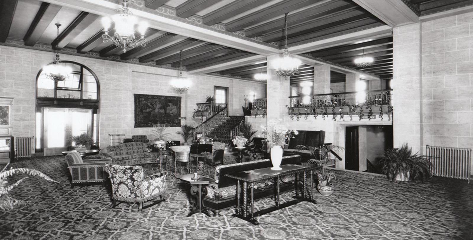 a room with a large table and chairs