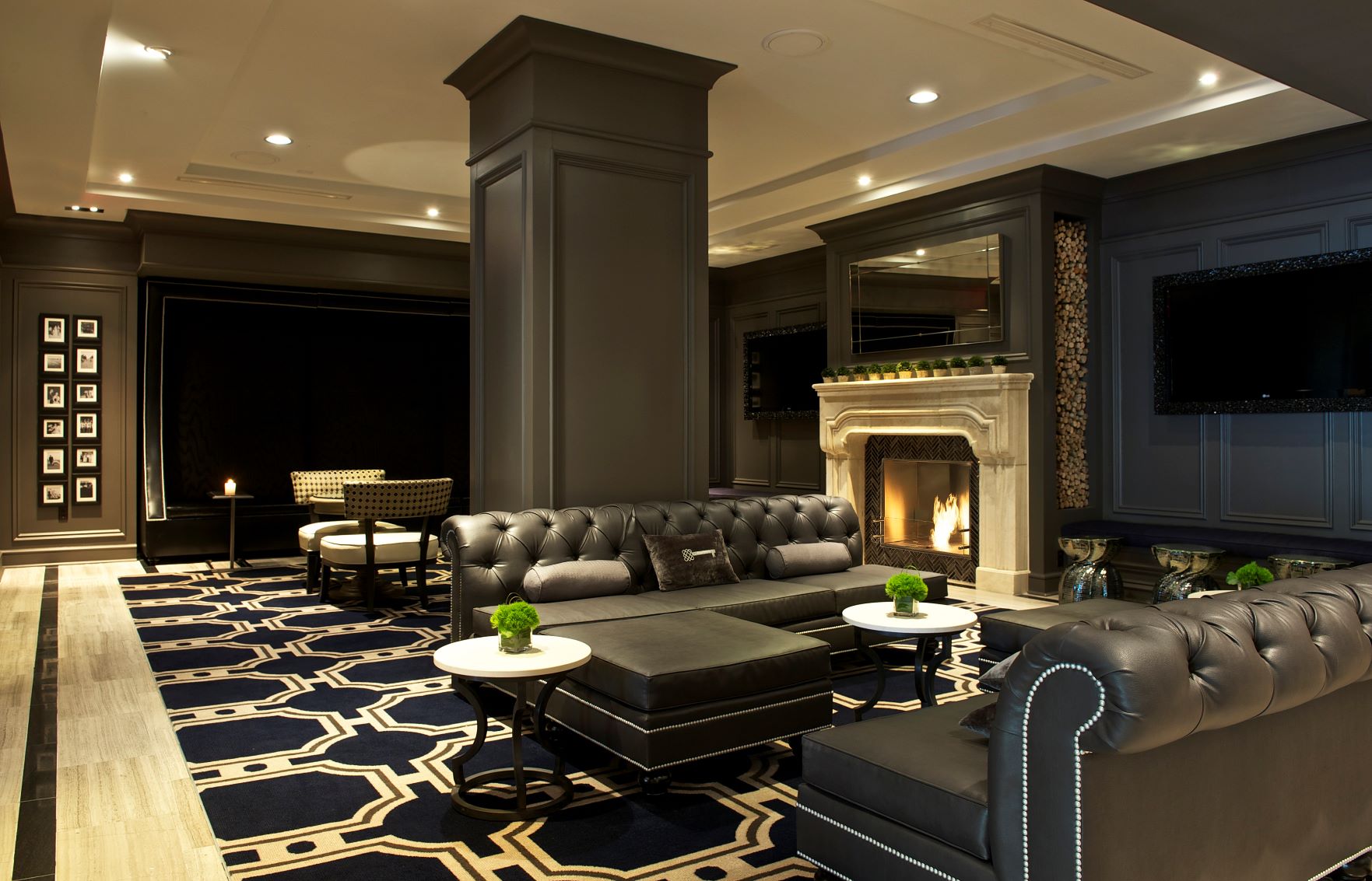 a room with a fireplace and couches
