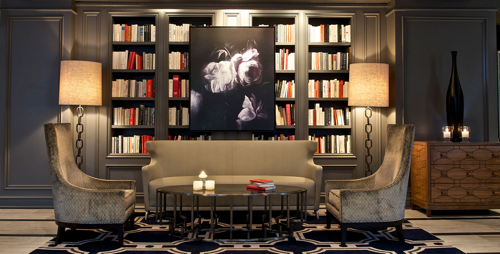 a room with a couch and bookshelves
