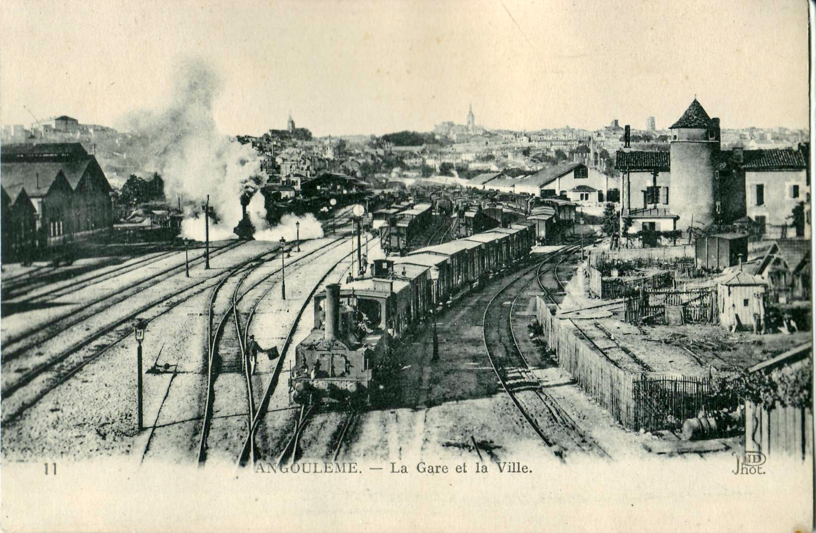 a train tracks with smoke coming out of it