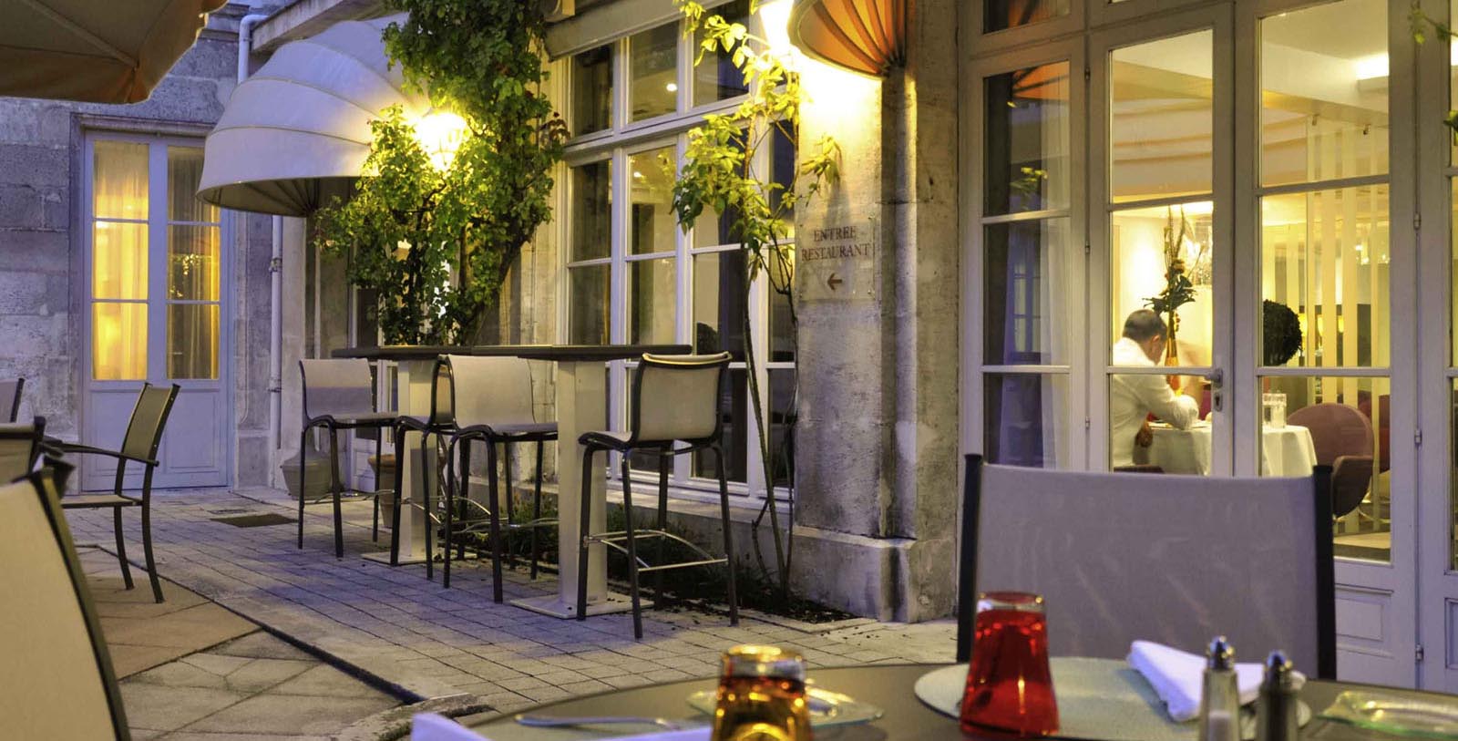 a restaurant with tables and chairs