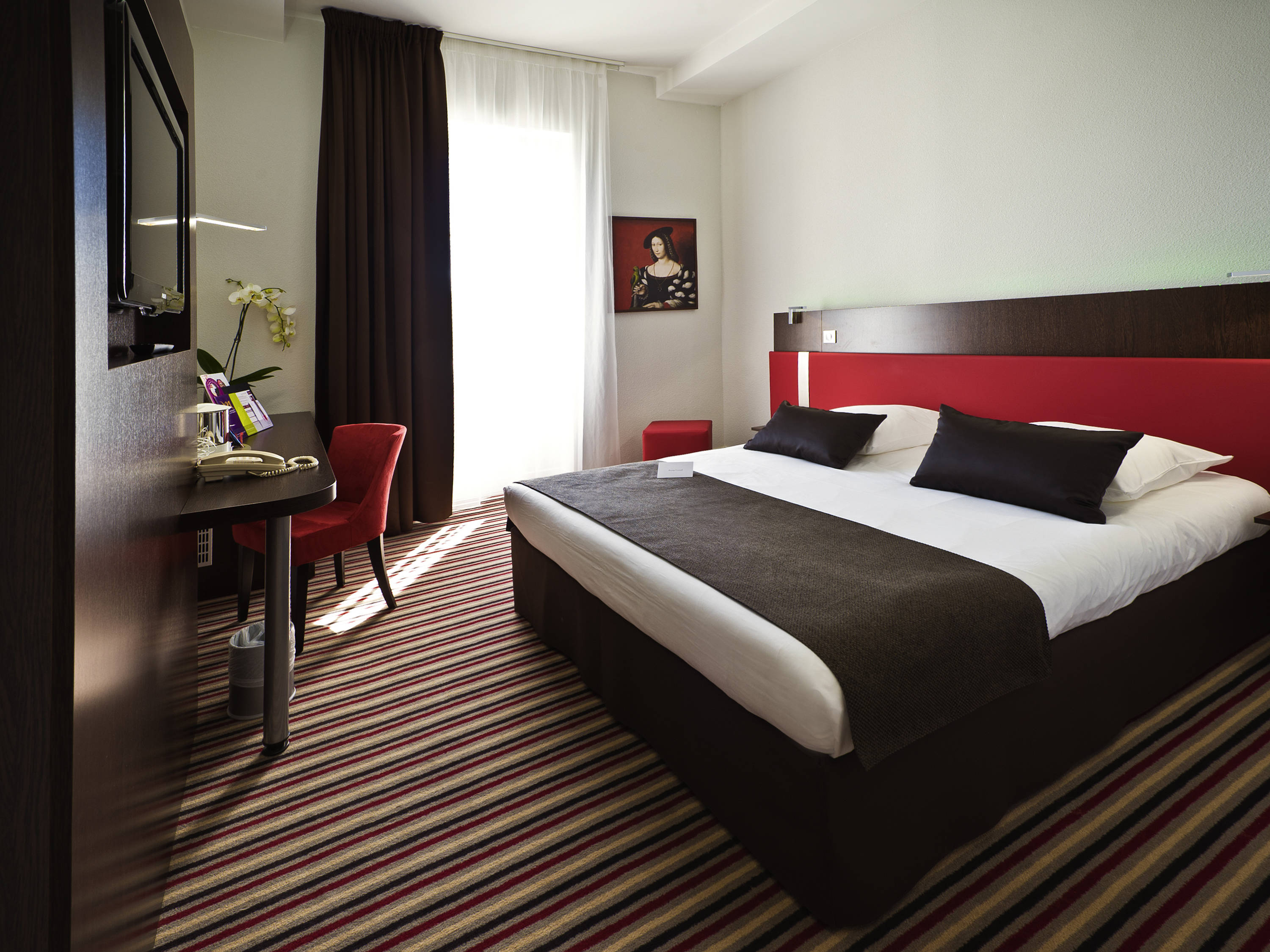 a room with a bed and a desk