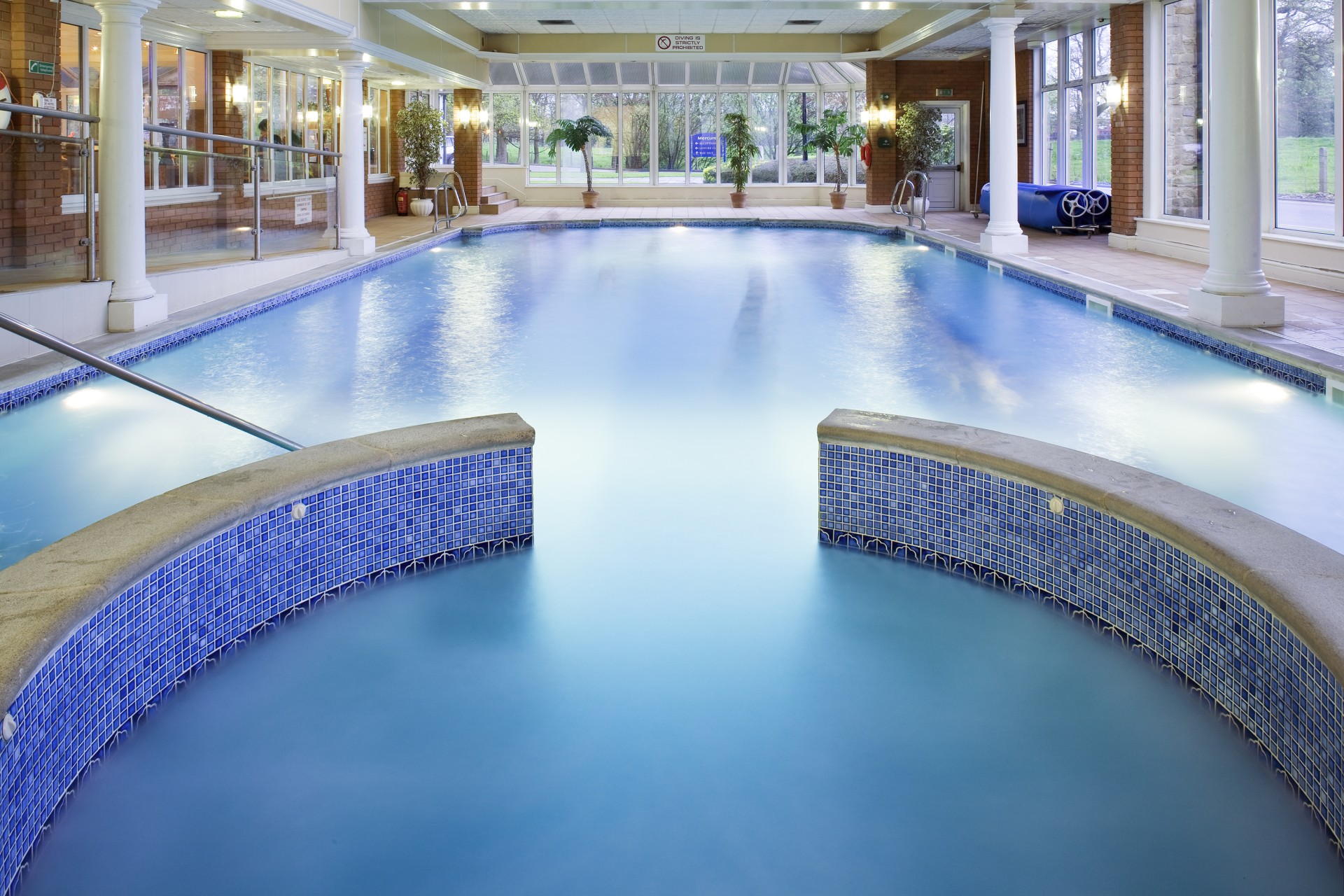 a swimming pool with a large tub