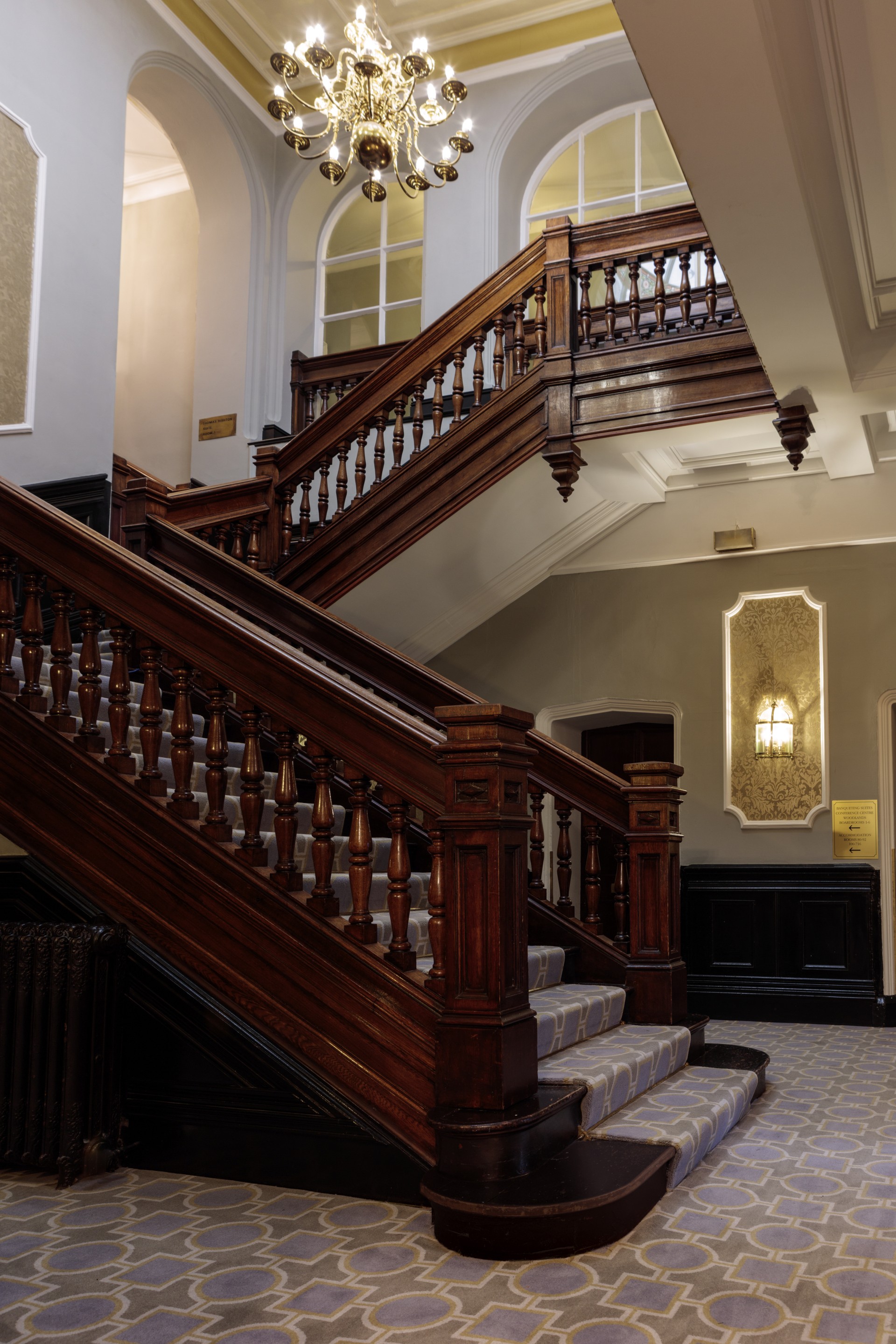 a staircase with wooden railings
