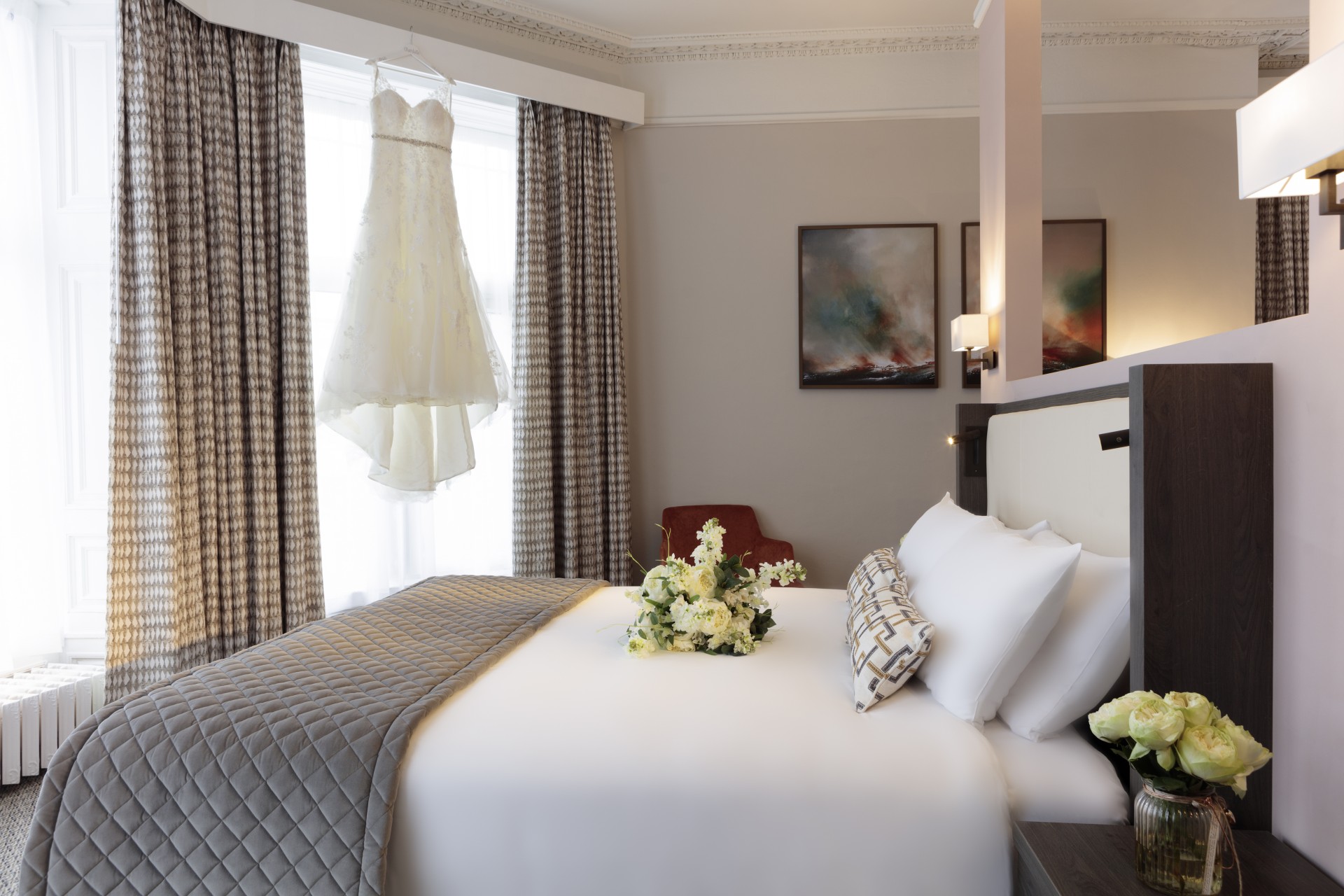 a wedding dress on a swinger in a hotel room