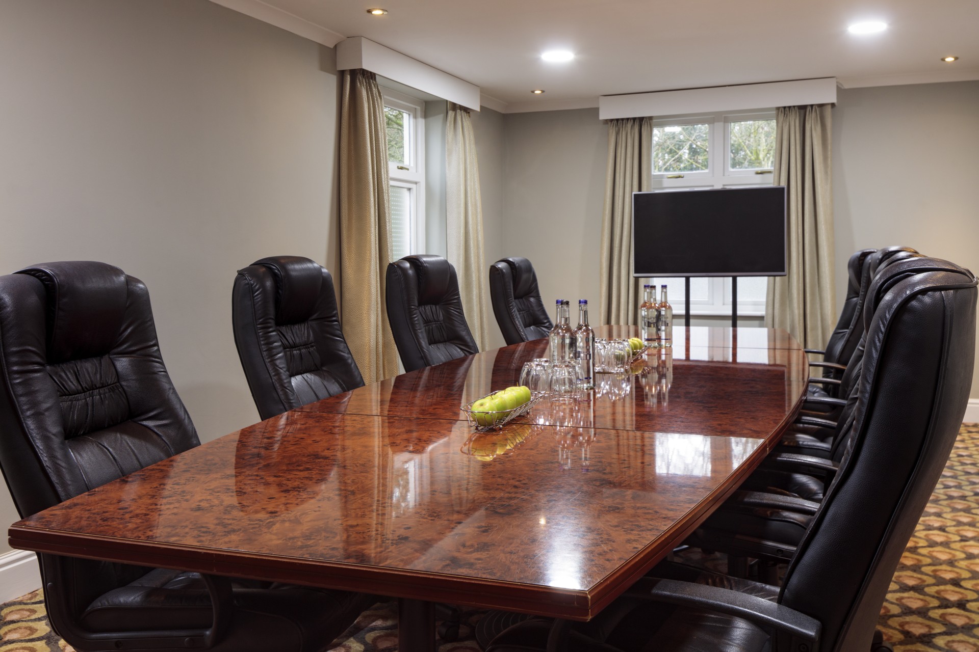 a conference room with a table and chairs