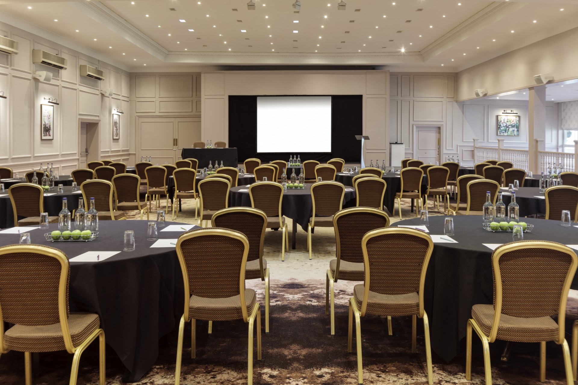 a large room with tables and chairs