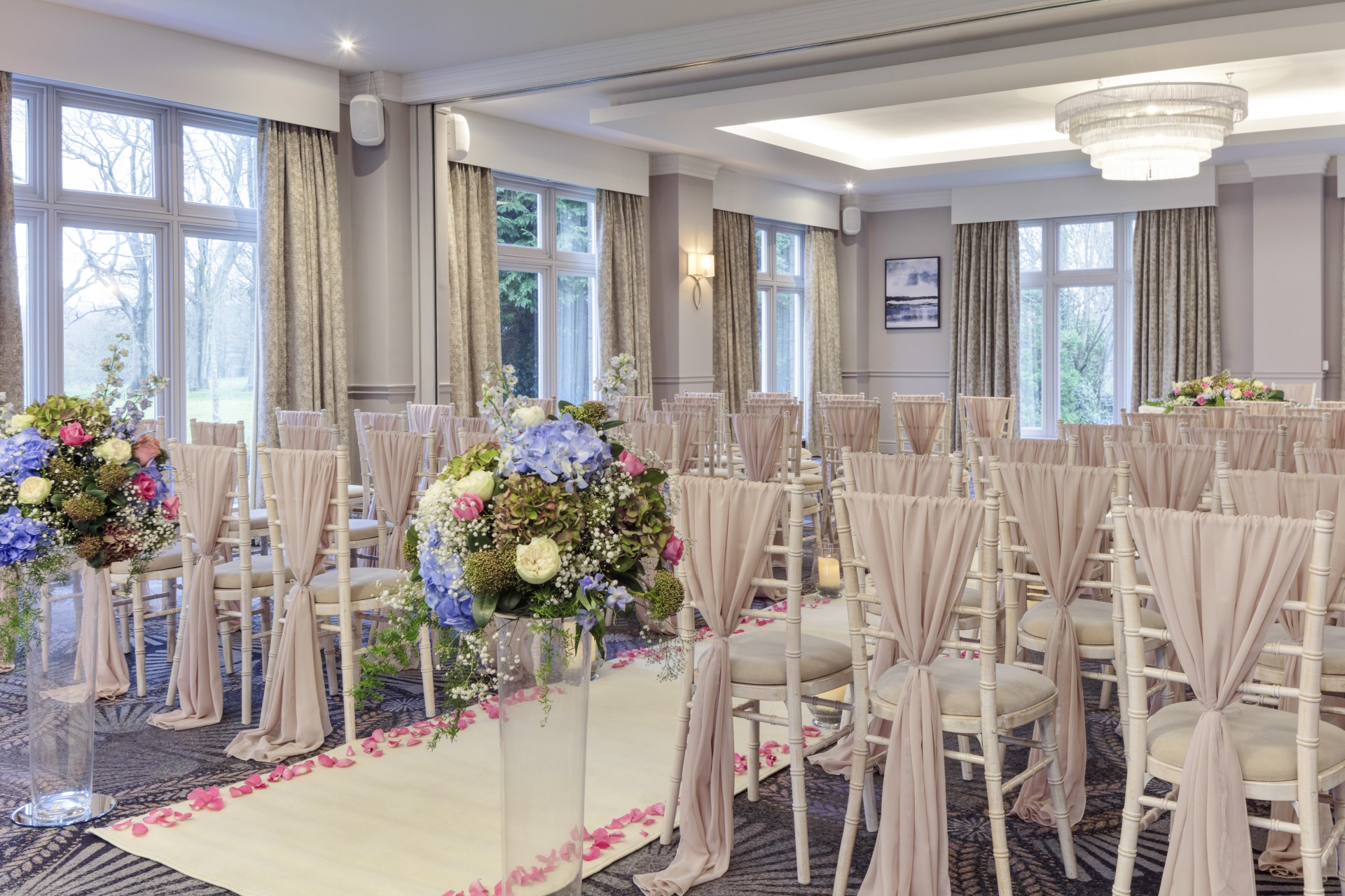 a room with chairs and flowers