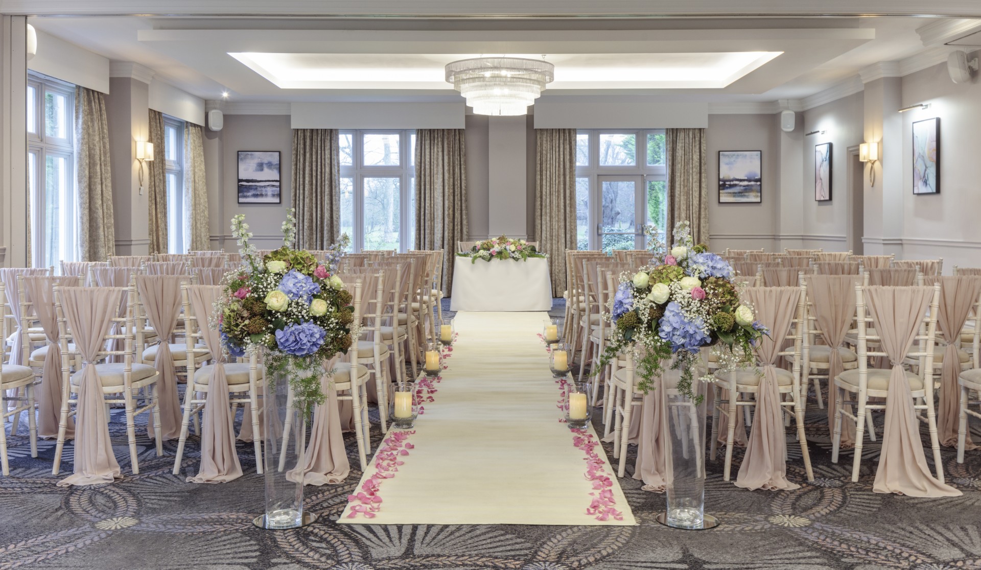 a wedding ceremony with chairs and flowers
