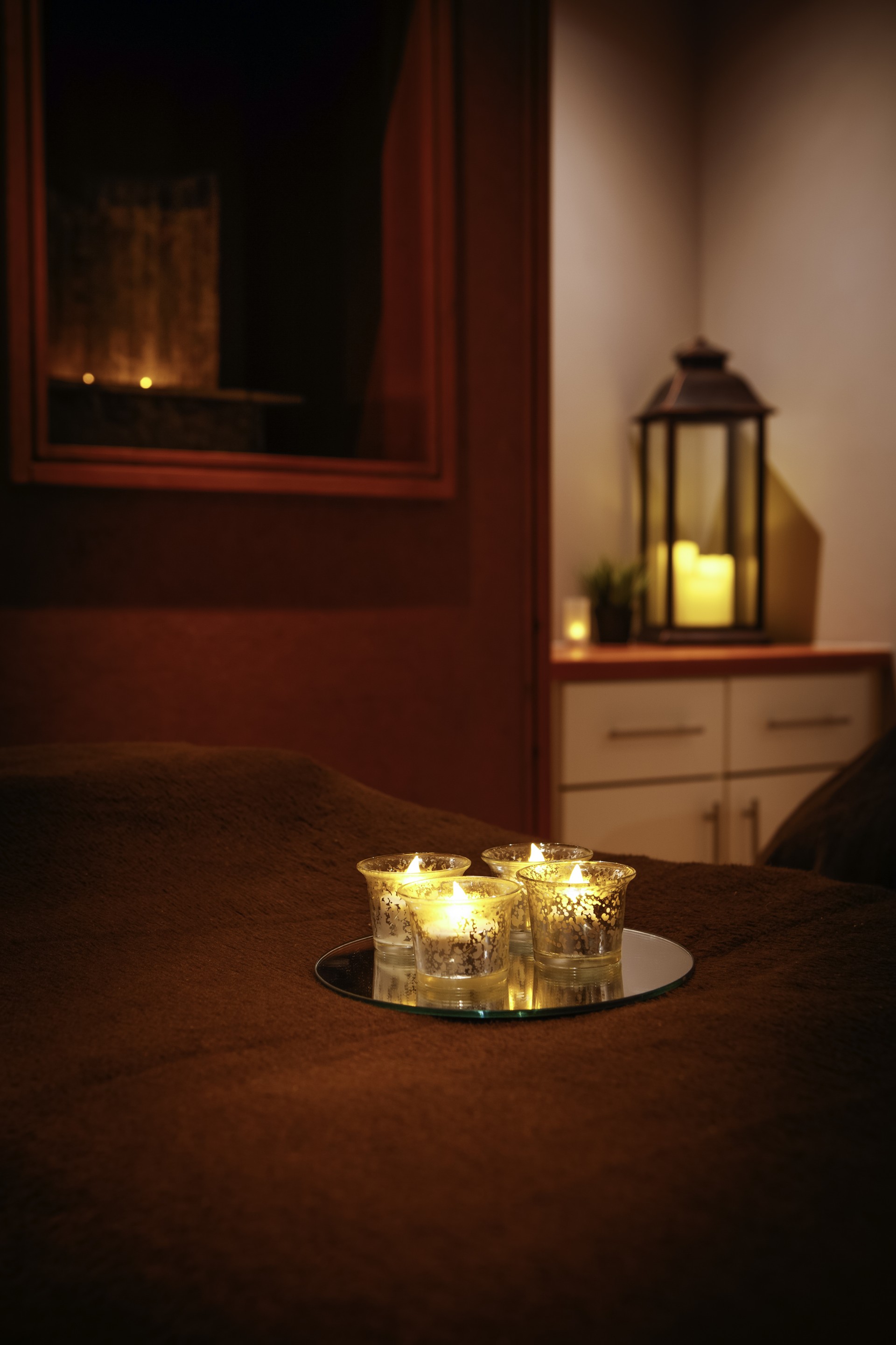 a group of candles on a tray