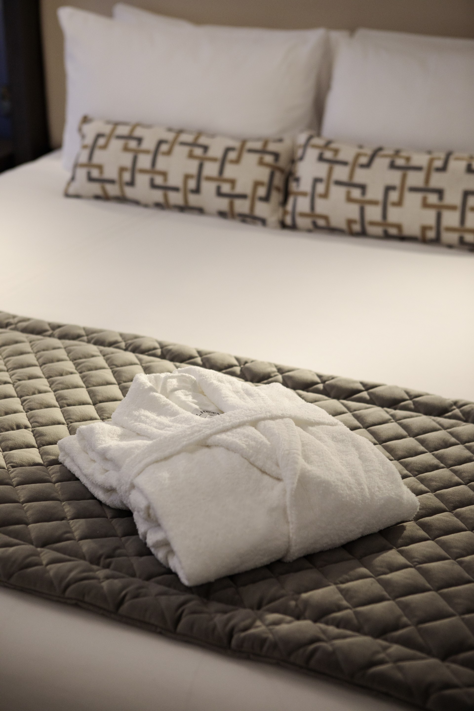 a white robe on a bed