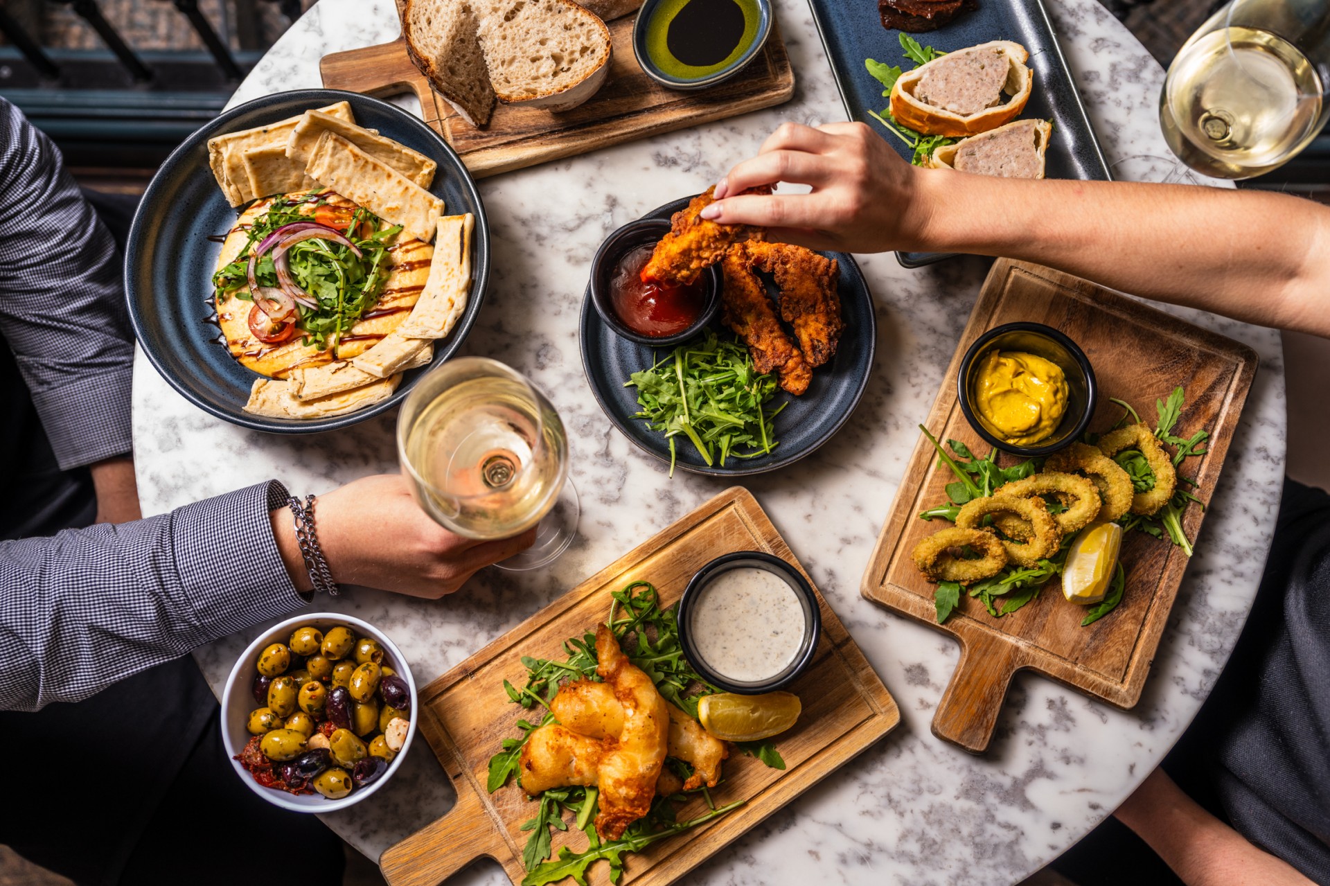 a person eating food on a table