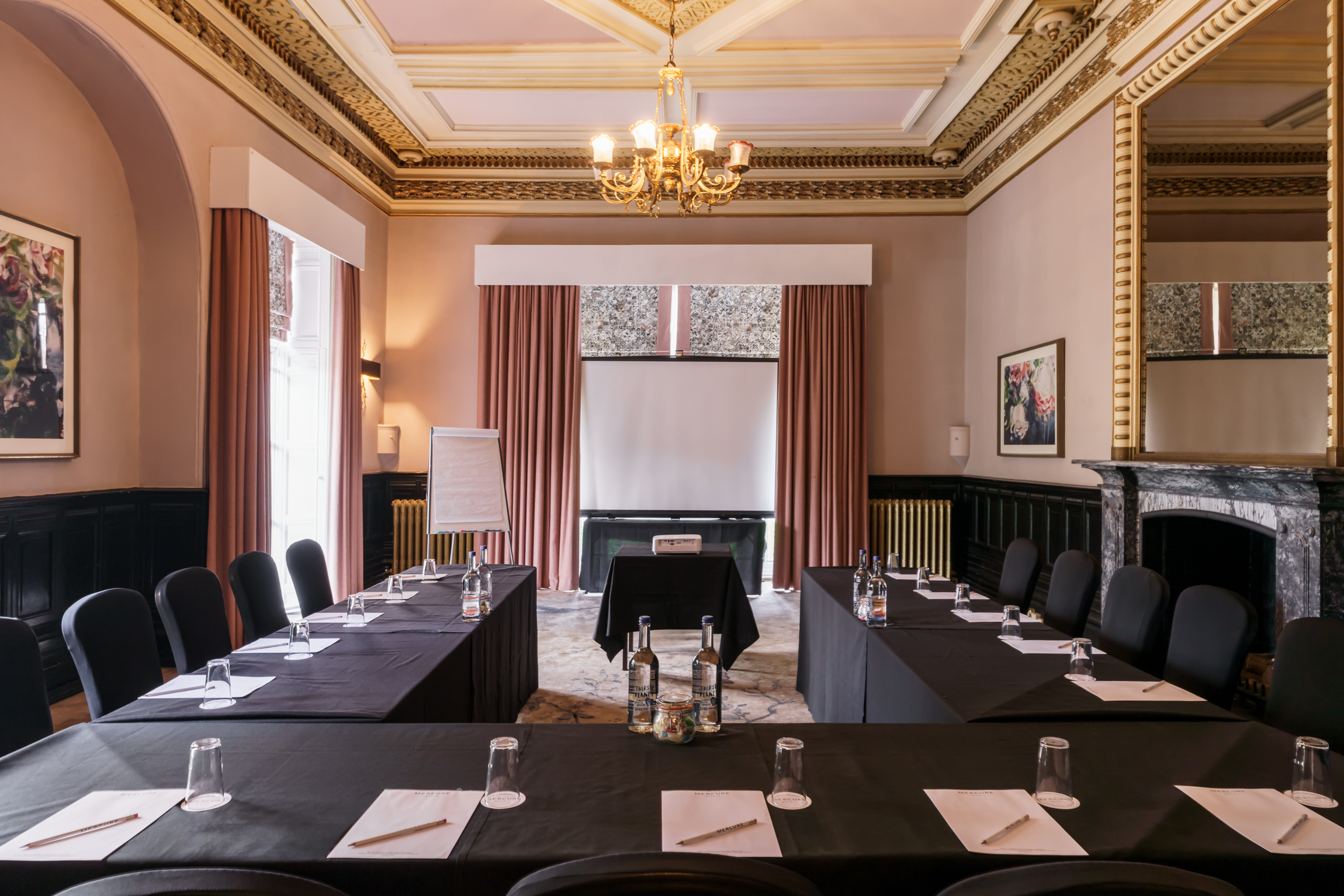 a room with black tables and chairs
