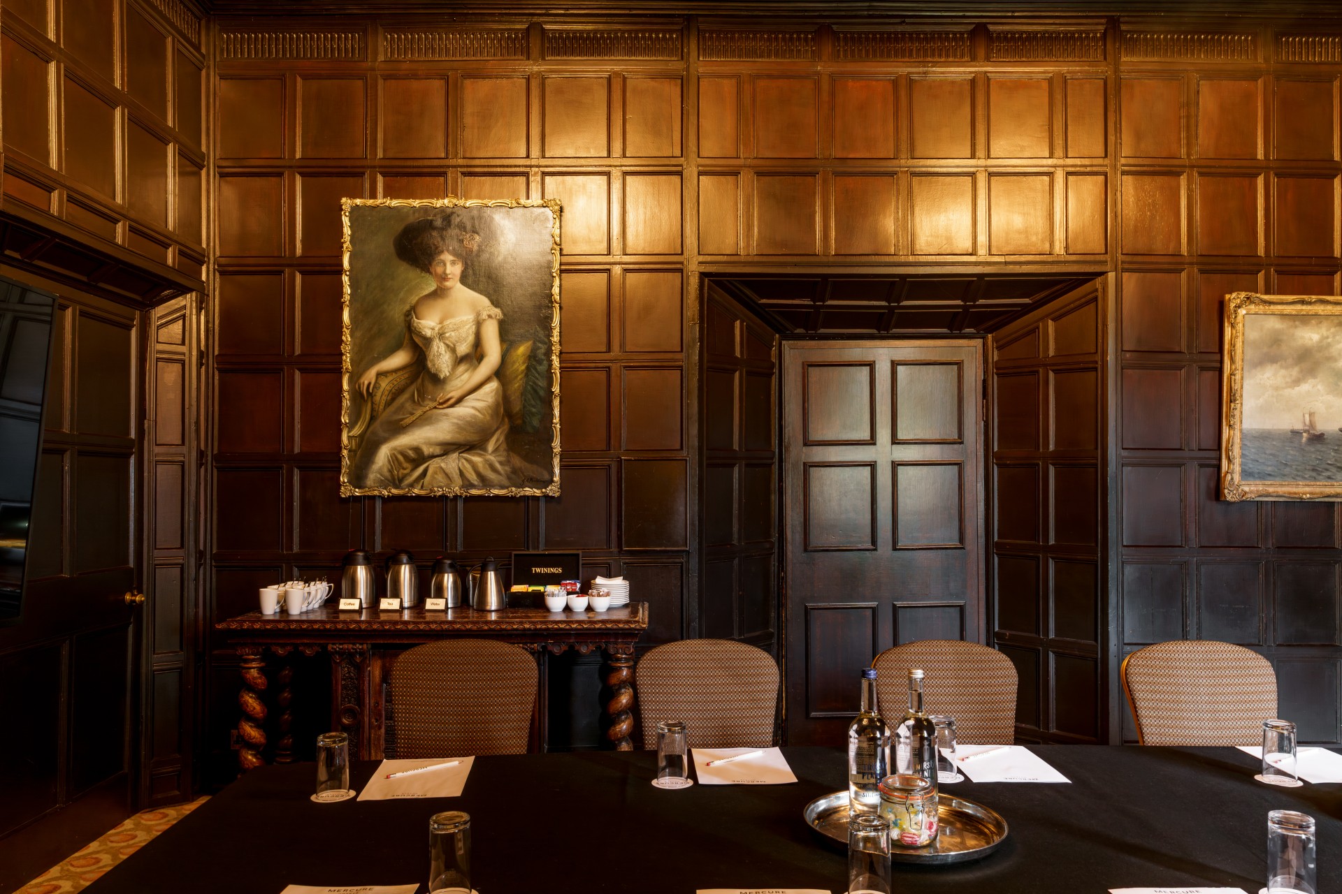 a room with a painting on the wall