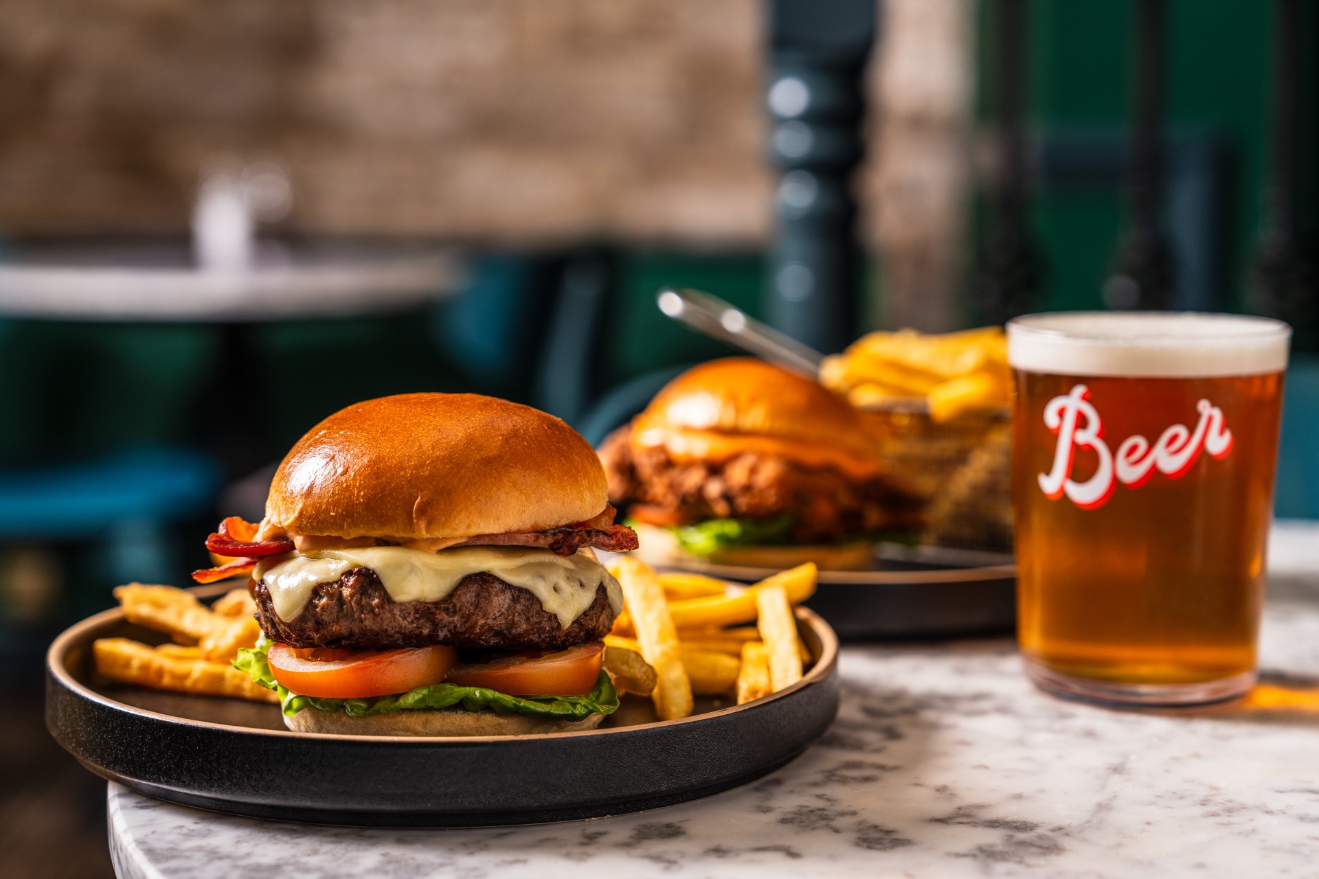 a burger and fries on a plate