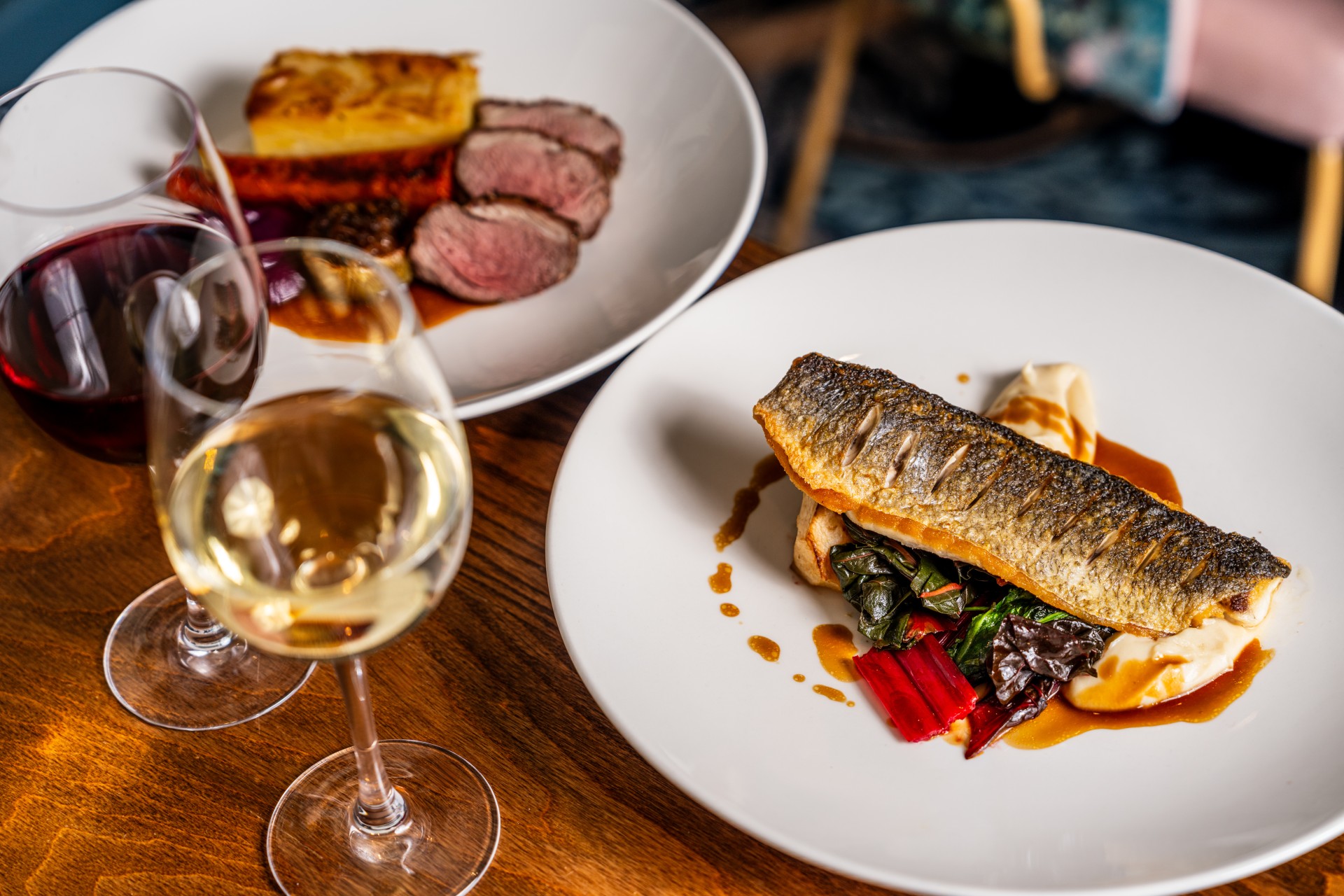 a plate of food and wine glasses