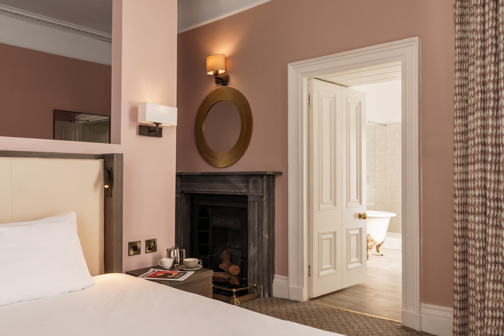 a room with a fireplace and a bed
