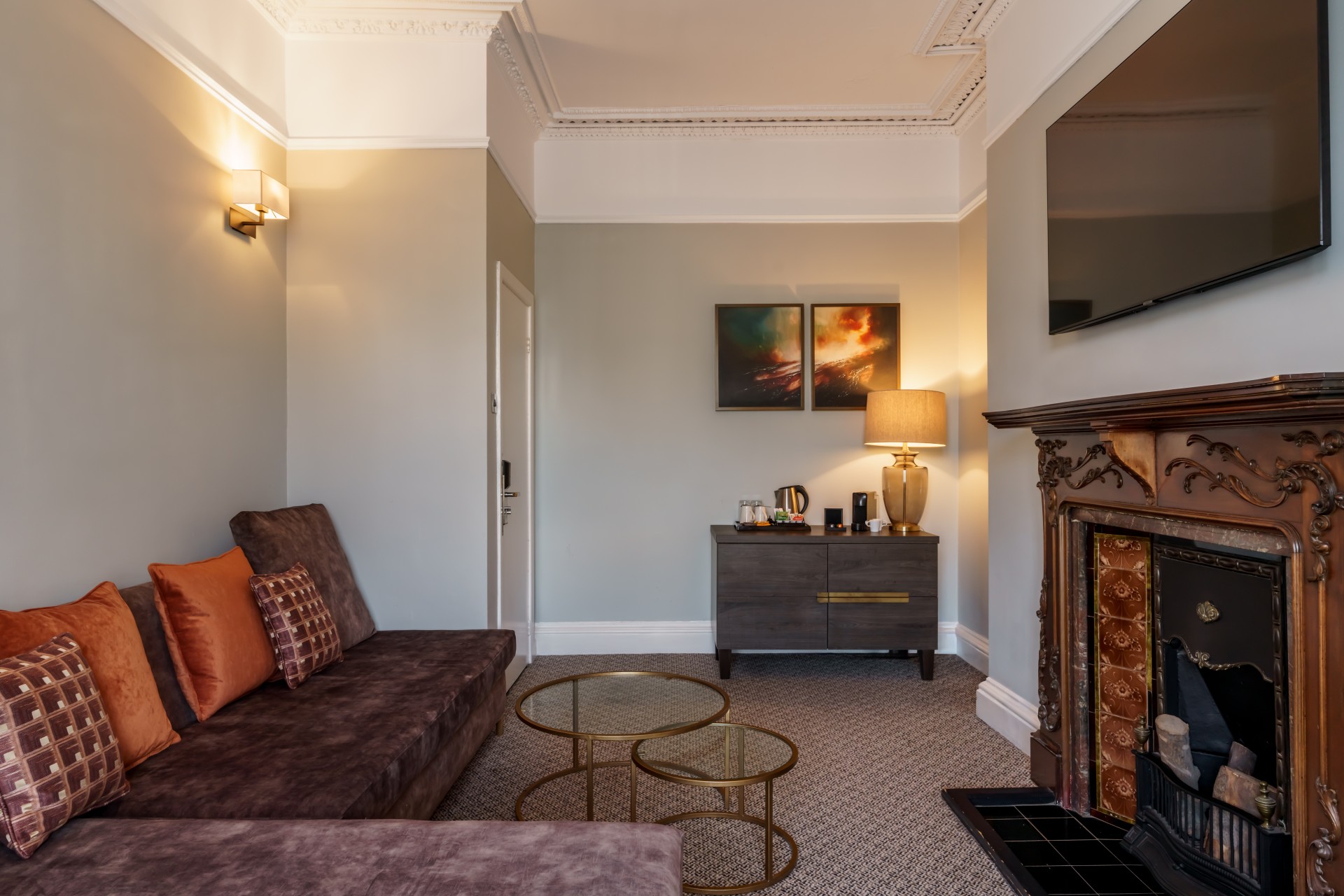 a living room with a fireplace and couch