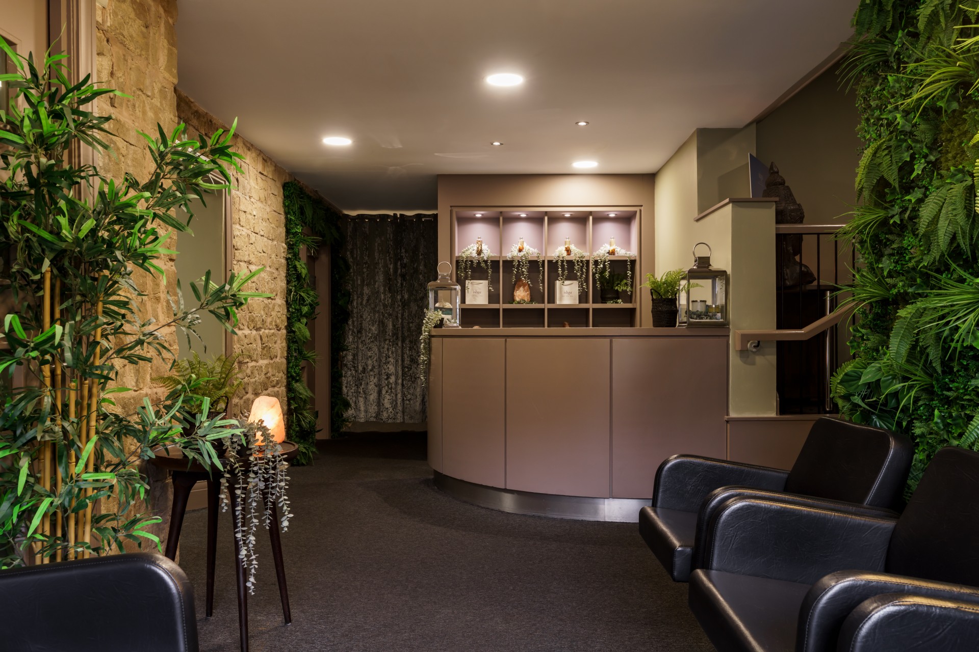 a room with a reception desk and chairs