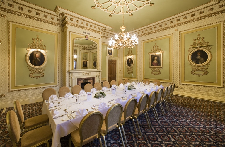 a long table set for a formal dinner