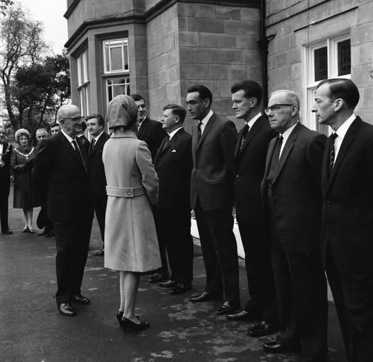 a group of people standing in a line