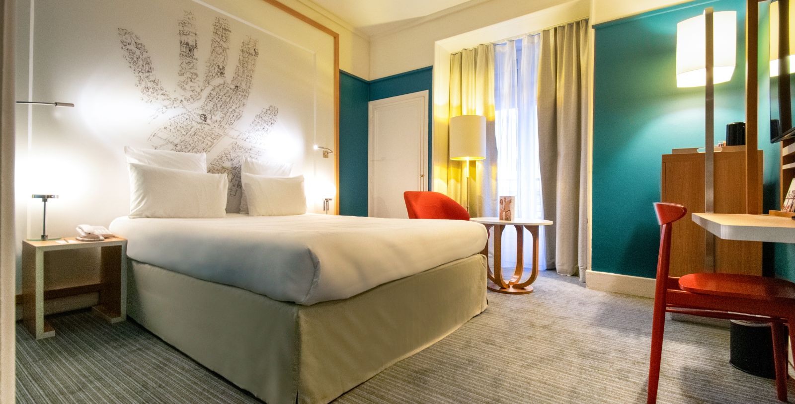a hotel room with a bed and a table