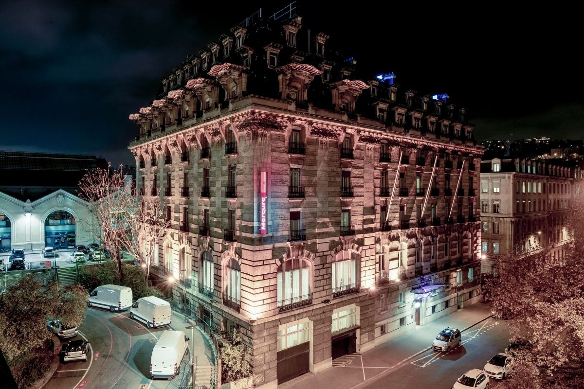 a building with lights on the side of it