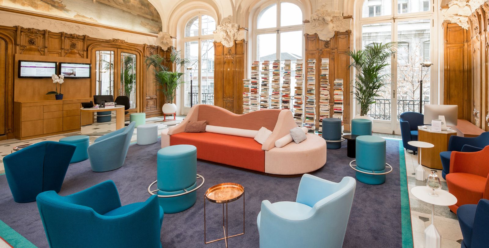 a room with a couch and chairs
