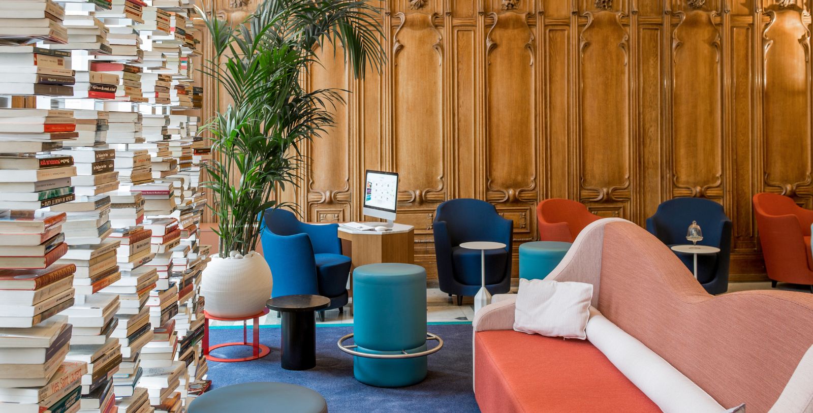 a room with a computer and chairs