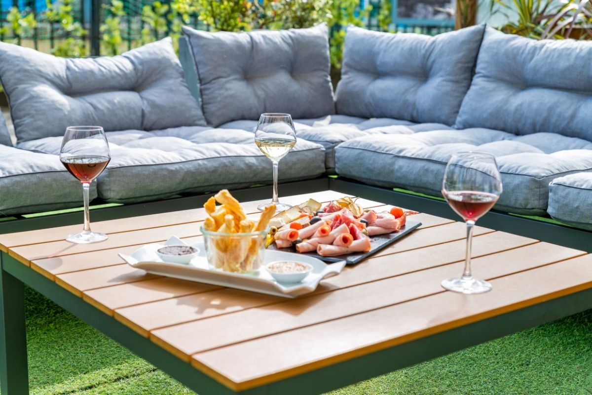 a table with food and wine glasses on it