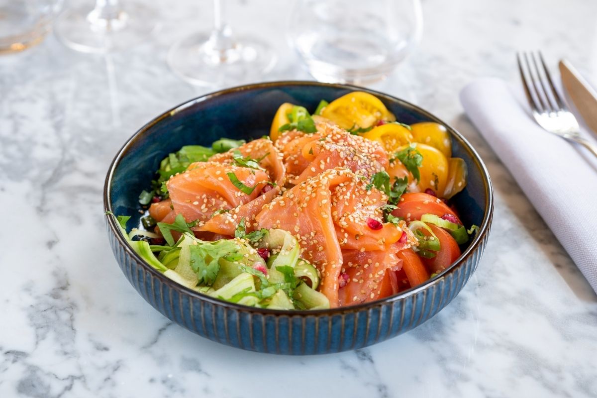 a bowl of food on a marble table