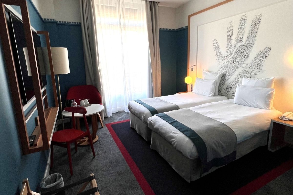 a room with two beds and a table