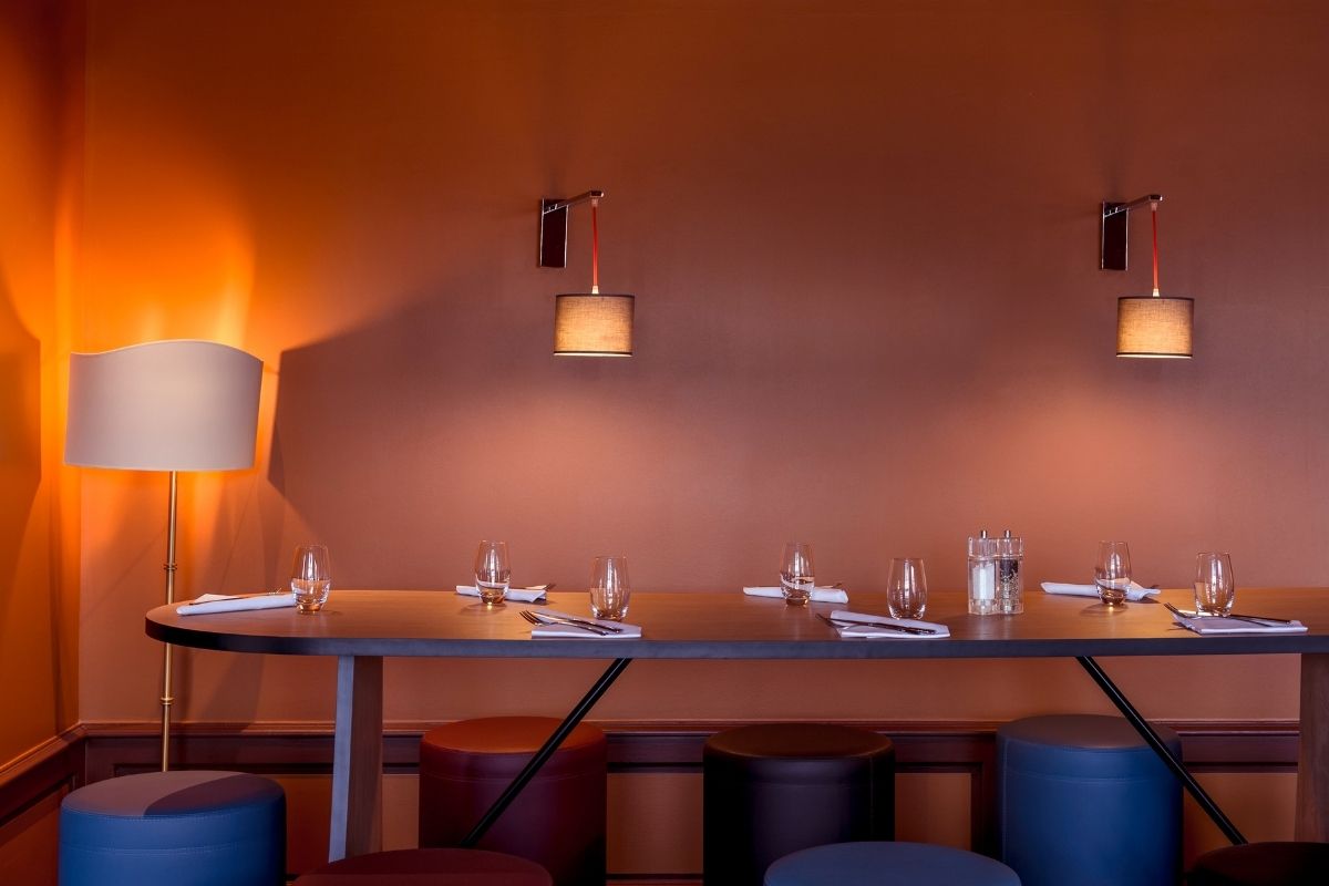 a table with glasses and utensils on it