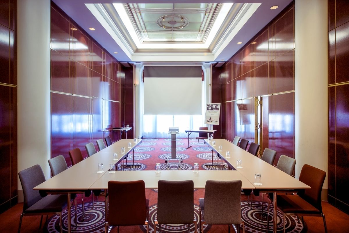 a conference room with a table and chairs
