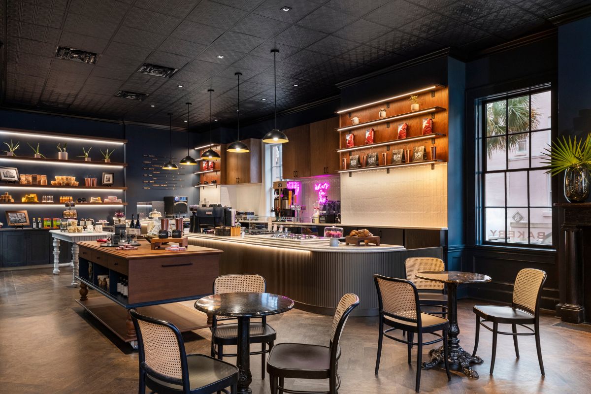 a coffee shop with a counter and chairs