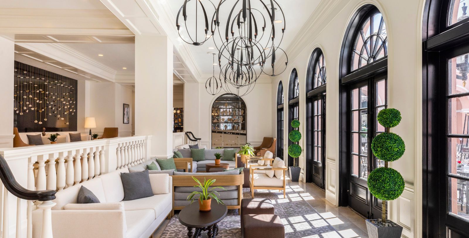 a room with a couch and chairs