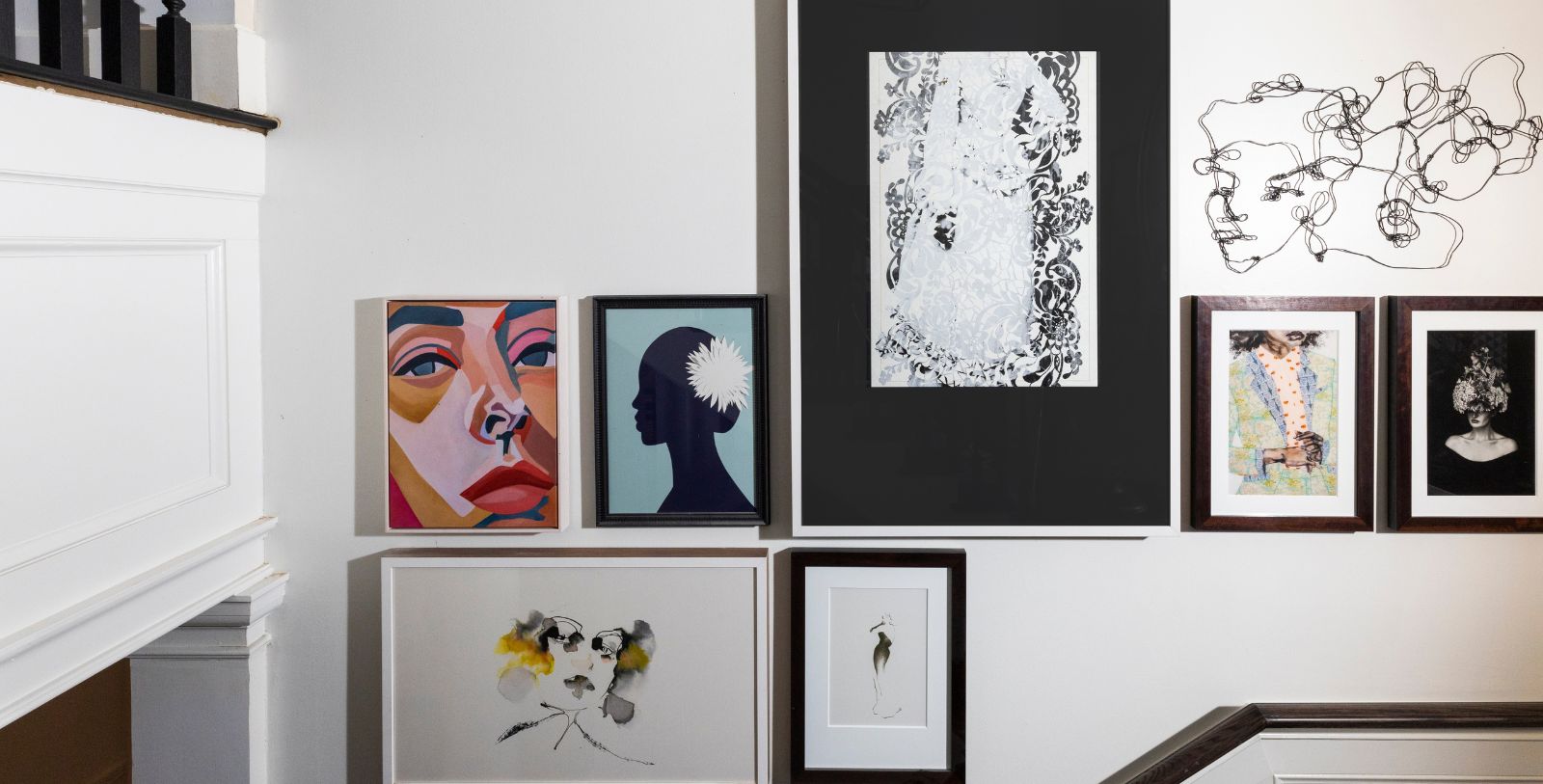 a group of framed pictures on a wall