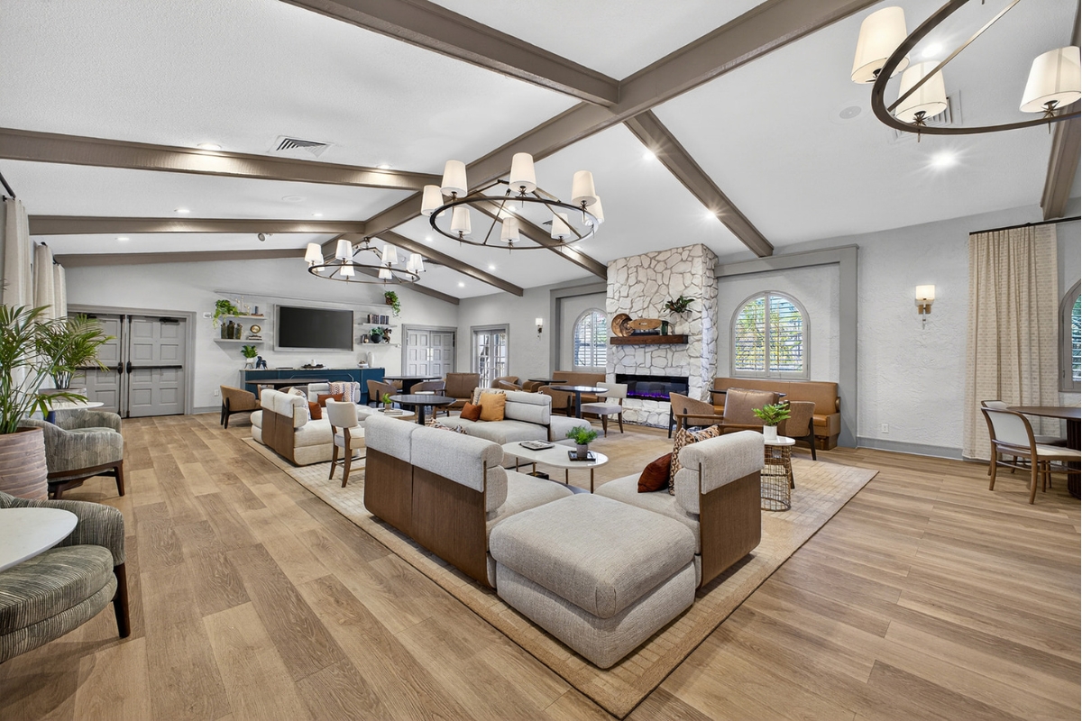 a large room with couches and a fireplace
