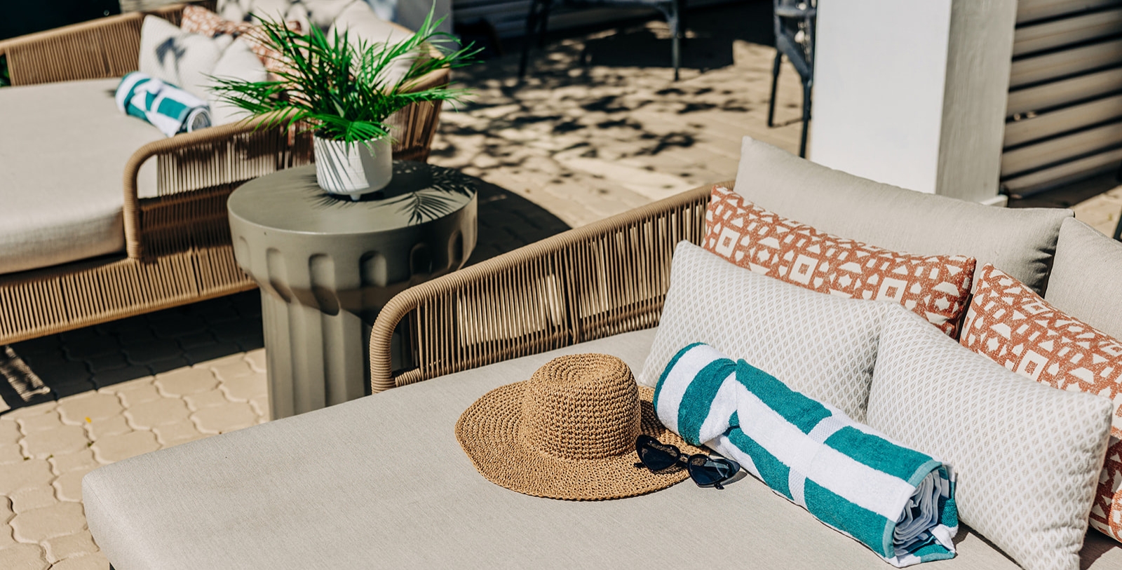 a hat and sunglasses on a table