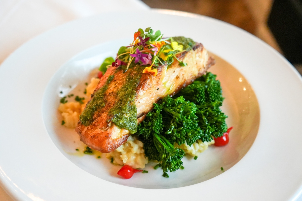 a plate of food with flowers on top