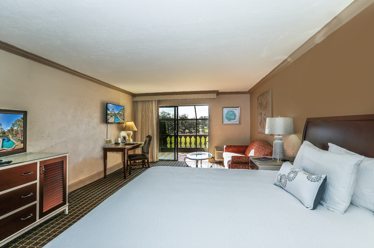 a room with a bed and a fireplace