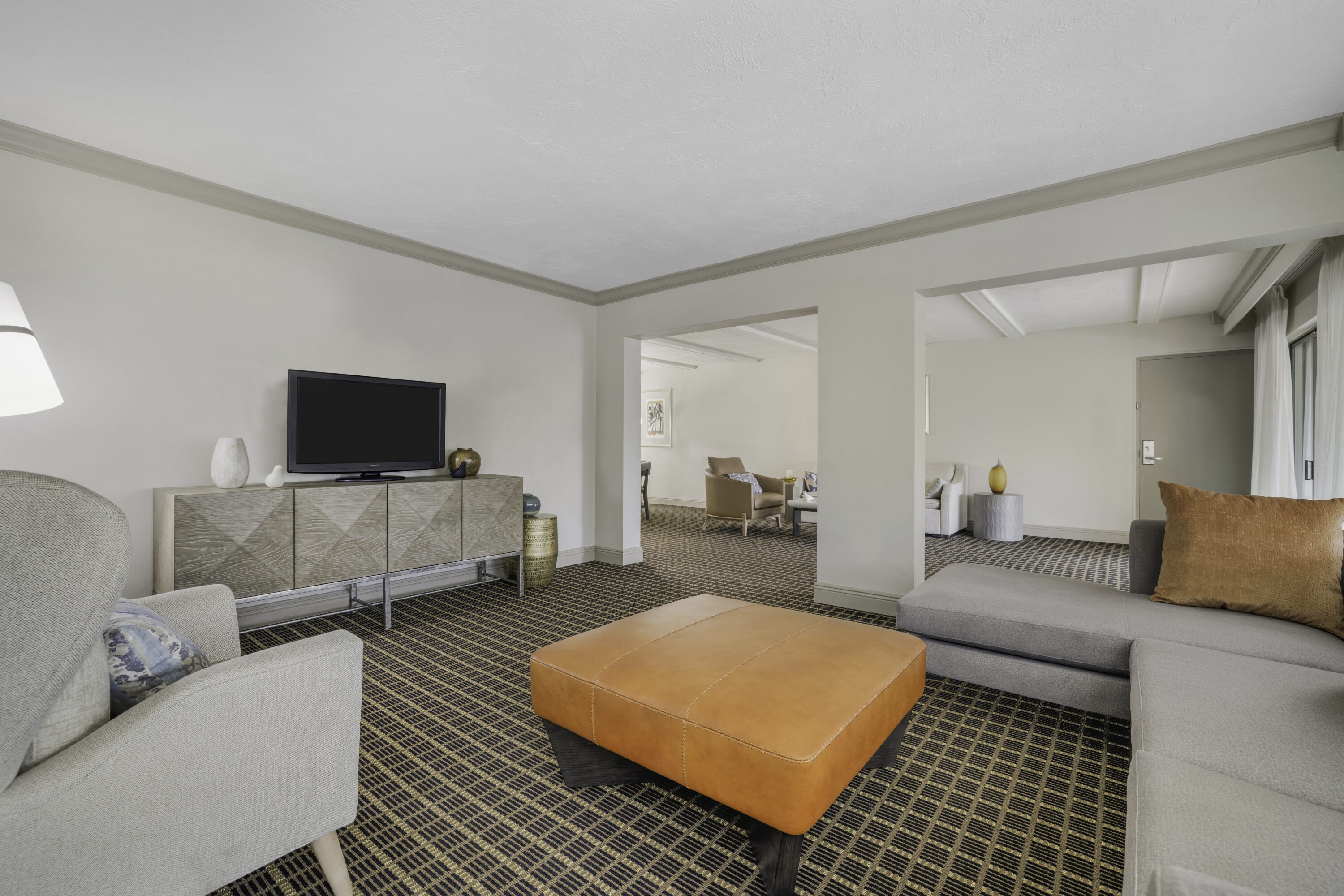 a room with a television and couches