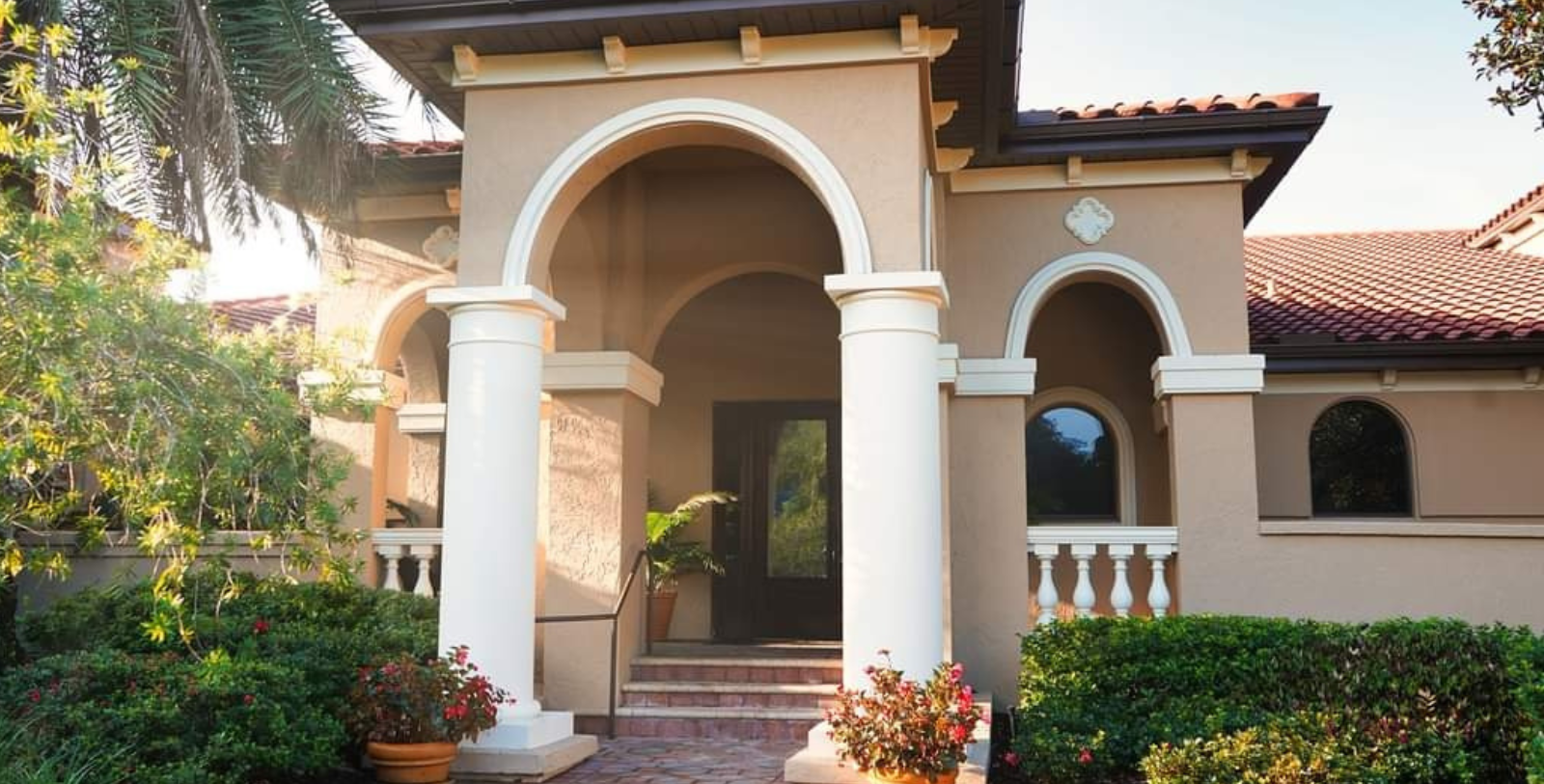 a house with columns and a door