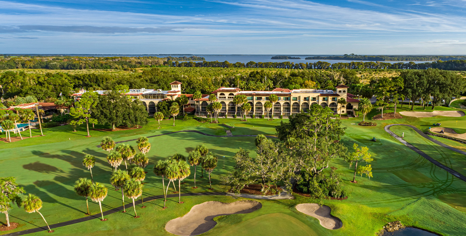 a building with trees and a golf course