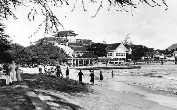 a group of people walking on a beach