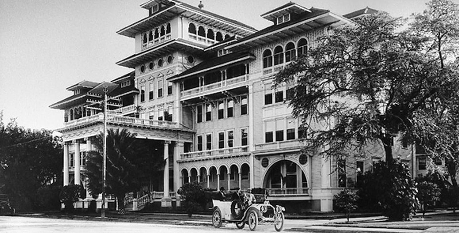 a large building with a car parked in front of it