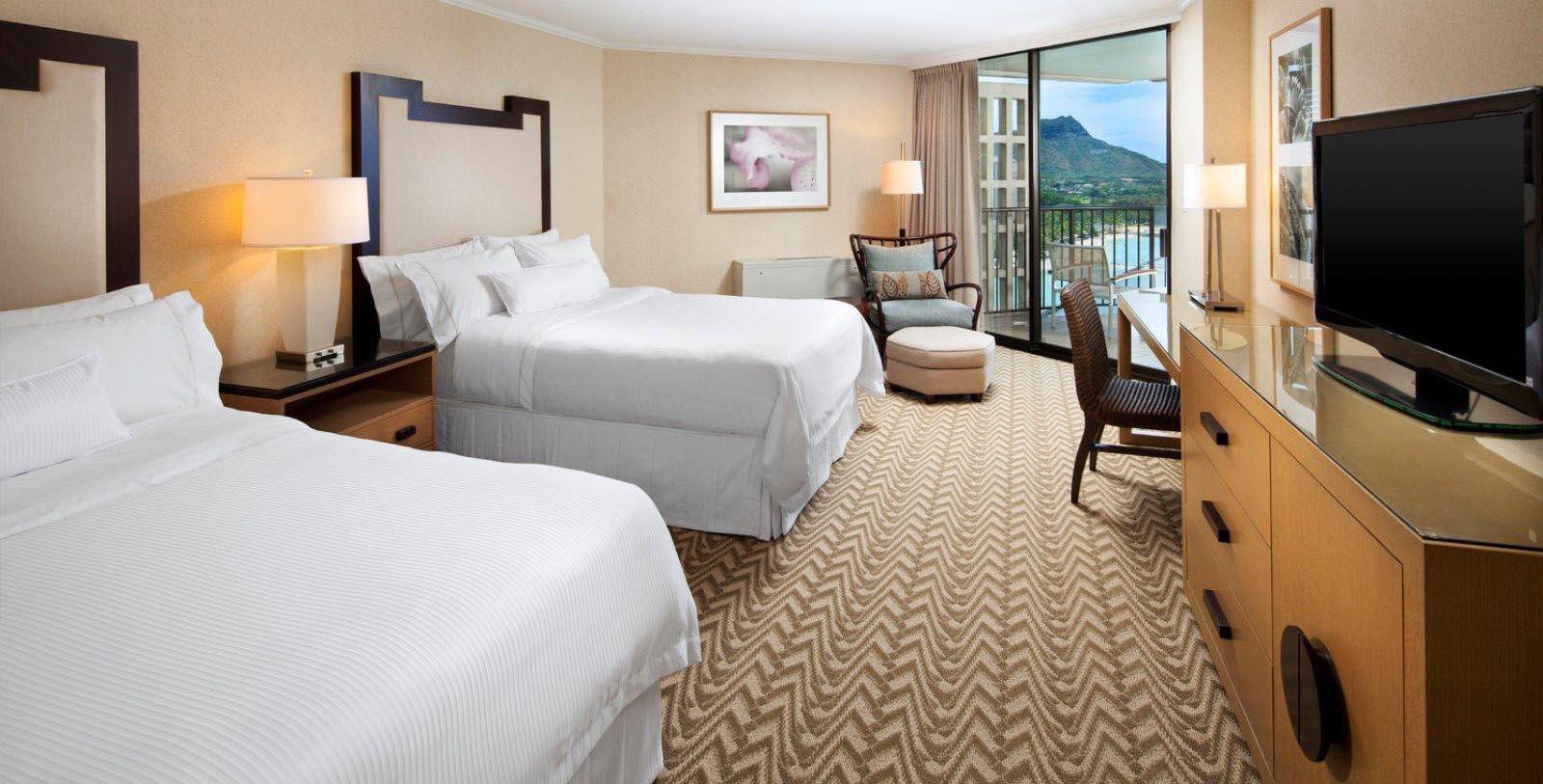 a hotel room with a view of the ocean